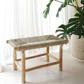 Beige wood bench with woven seagrass seat