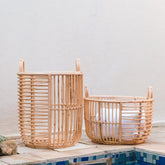 Beige woven rattan laundry basket with handles