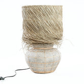 Beige and grey terracotta table lamp with rattan grid and fringed grass shade