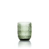 Green textured glass tumbler on a white background