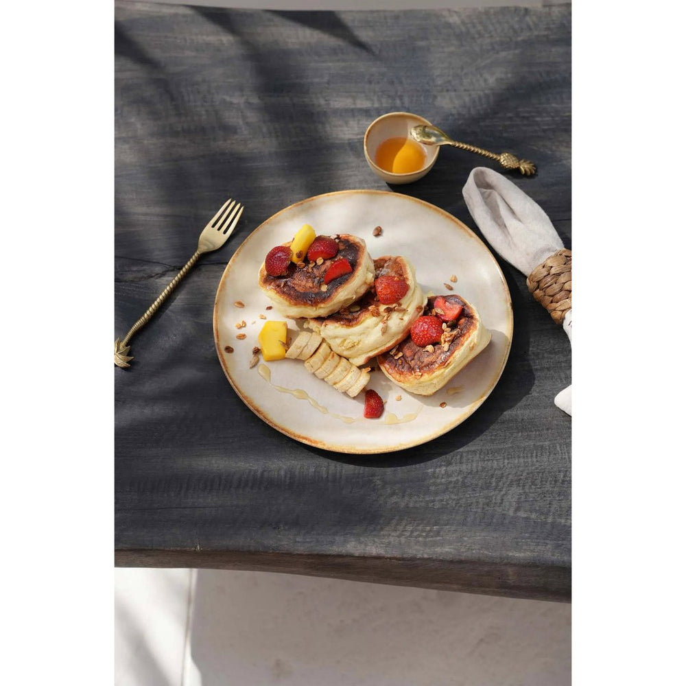 White stoneware sauce bowl with amber rim