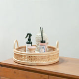 Beige round rattan serving tray