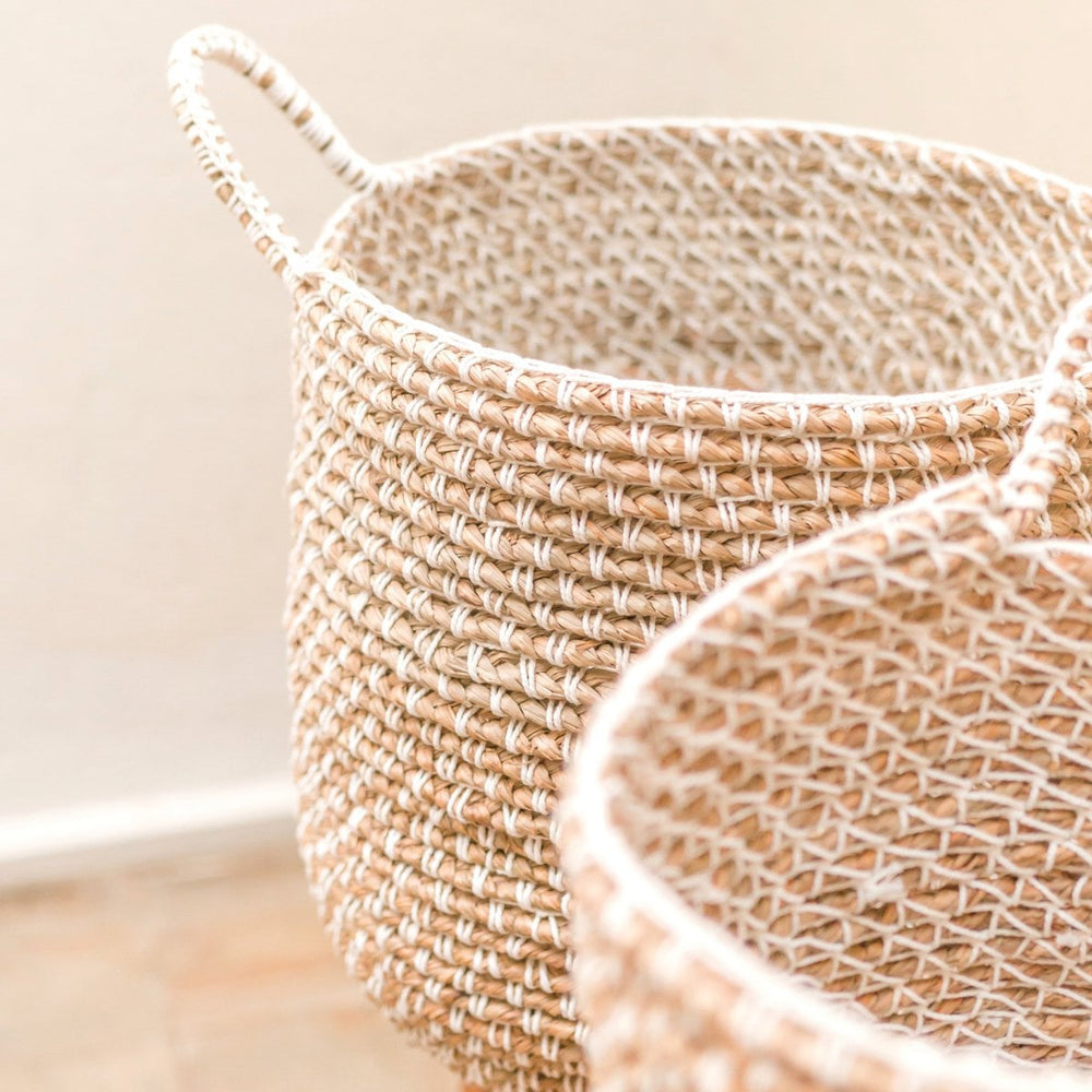 Beige woven banana fibre storage basket with white cotton cord pattern