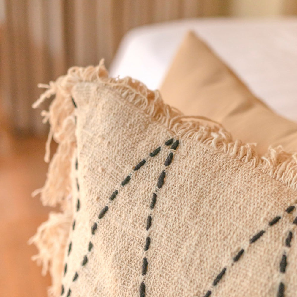 Black and white handwoven cotton cushion cover with zigzag pattern and fringes