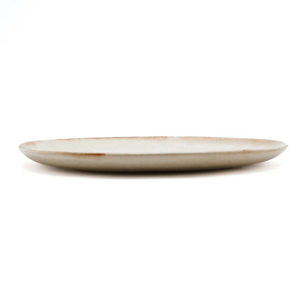 White stoneware dinner plate with burnt-umber rim