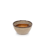 Ceramic bowl with brown interior on a white background