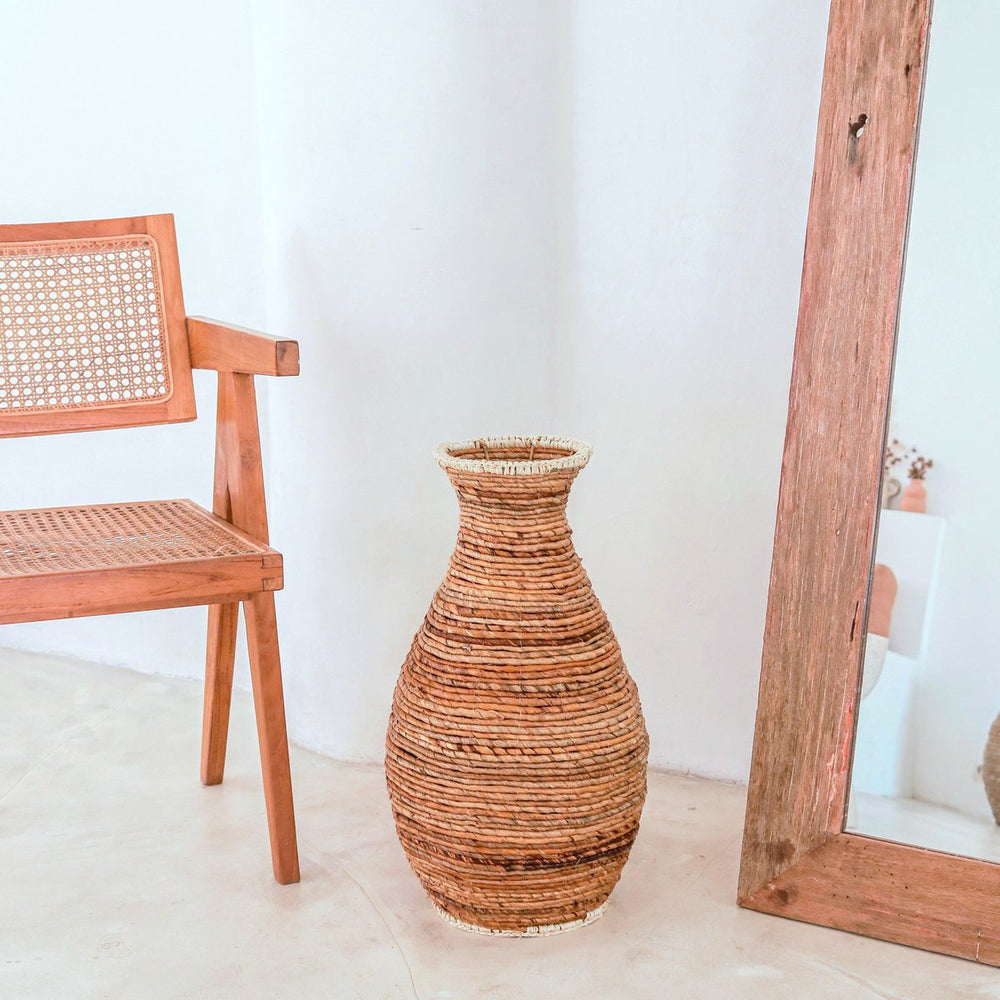 Beige and brown handwoven banana fiber vase with raffia accents